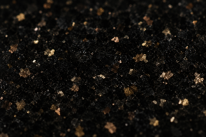 Black Galaxy granite polished surface showing golden-bronze mineral speckles — exclusively quarried in Ongole, Andhra Pradesh, India, Nirvan Exports