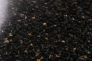 Polished Black Galaxy granite surface showing golden bronze flecking