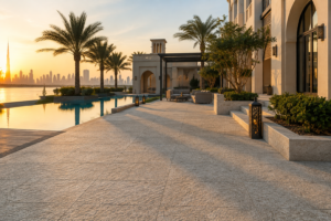 Light granite pool surround paving at a Dubai villa terrace